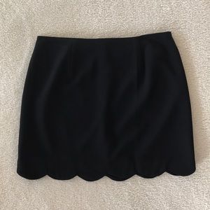 Scalloped black mini skirt